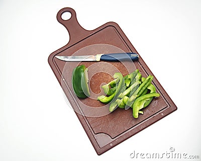 Green pepper fruit lies on the cutting Board Stock Photo