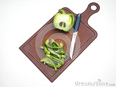 Green pepper fruit lies on the cutting Board Stock Photo