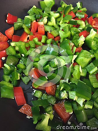 Green peppers red peppers jalenpeÃ±os sautÃ©ed with olive oil Stock Photo