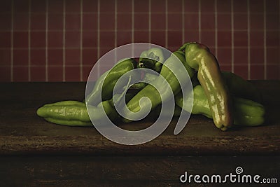 green peppers stacked on a table Stock Photo