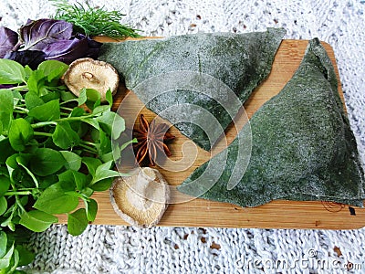 Green pies, dough cooked from nettle Stock Photo