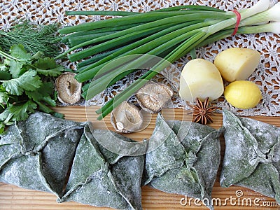 Green pies, dough cooked from nettle Stock Photo