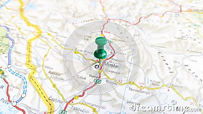 A green pin stuck in Mostar on a map of Croatia Editorial Stock Photo