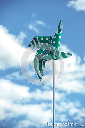 green pinwheel on sky Stock Photo