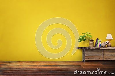 green plants pottery vase on drawer wooden in empty yellow vintage living room interior Stock Photo