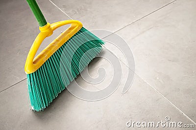Green plastic broom Stock Photo