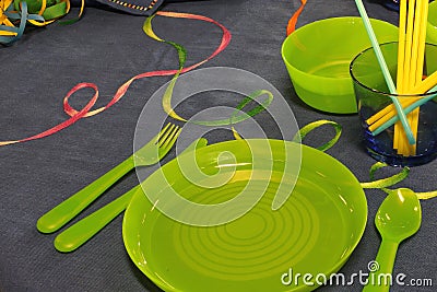 Green plates on the prepared table to celebrate a birthday Stock Photo