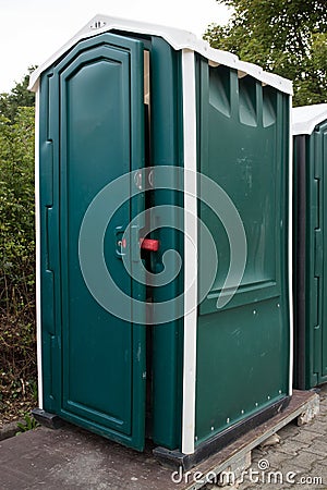 Portable plastic toilet on construction site Stock Photo