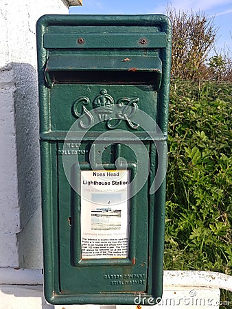 A green post box from the reign of King George VI in Scotland Stock Photo