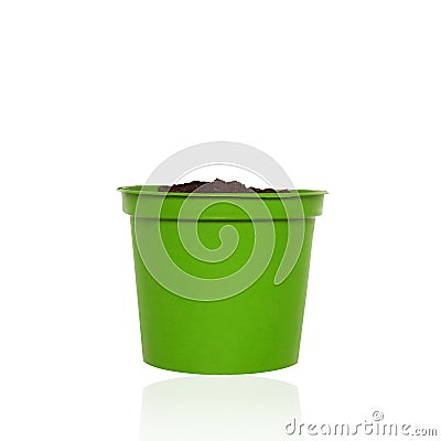 Green pot with handful soil for growing plant isolated on white background Stock Photo