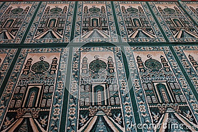 Green prayer mat on the mosque Stock Photo