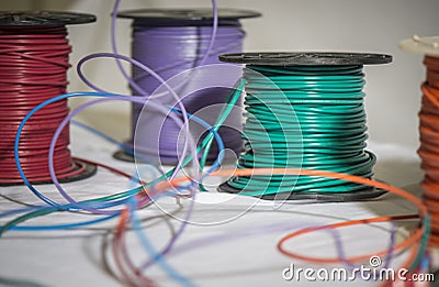 Green purple red spools of wire Stock Photo