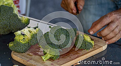 Green, raw and fresh broccoli, cutting knife and board, healthy food Stock Photo