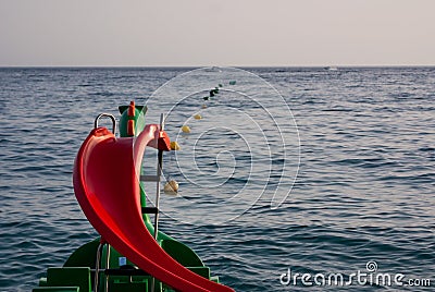 Green and red dragon pedalo, pedal boat, paddle boat Stock Photo