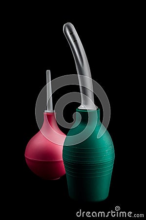 Green and red pear white tip for enema, isolate on a black background Stock Photo