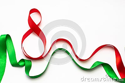 Green and red ribbons on a white background, gifts for loved ones Stock Photo