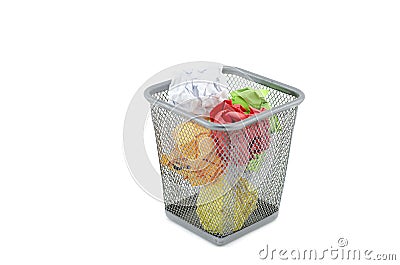 Green,red,white,and yellow crumple paper on metal dustbin Stock Photo