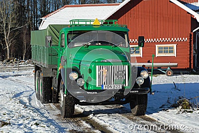 Retro Volvo truck from 1972 on snowy roads Editorial Stock Photo