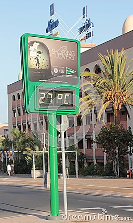 a green advertising roadside sign in gran canaria showing the temperature in degrees celcius Editorial Stock Photo