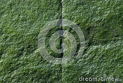 Green Rock - Vertical Crack Stock Photo