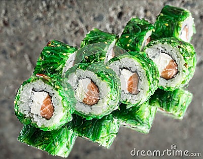 Green roll made with salmon, chuka, cream cheese Stock Photo