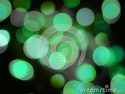 Green round glowing bright light abstract lights on a black background Stock Photo