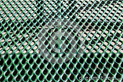 green rubber coated outdoors metal prison park picnic table Stock Photo