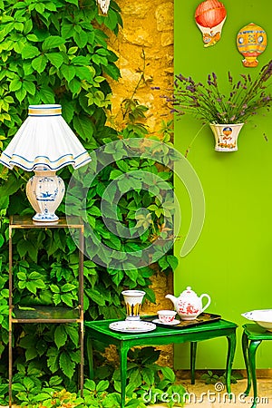 Green rustical styled decoration of front of house with flowers Stock Photo