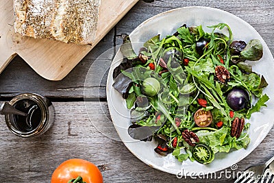 Green Salad with Green Tomatoes,Pecan and Goji berry Stock Photo