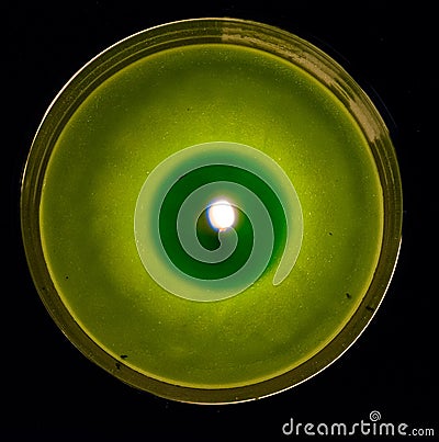 Green Scented Candle Burning Dark Background Above Perspective Stock Photo