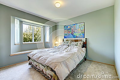 Green simple bedroom with small bed. Stock Photo