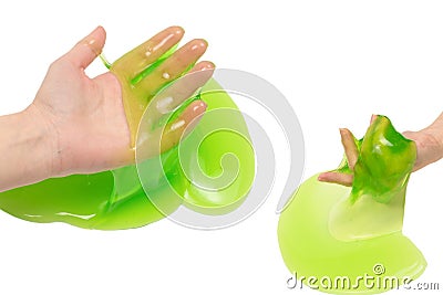 Green slime toy in woman hand isolated on white background Stock Photo