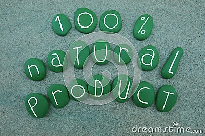 100 percent natural product, slogan with green painted stones over green sand Stock Photo