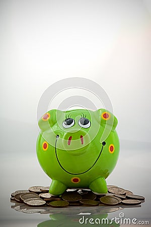 Green smiling piggy bank Stock Photo