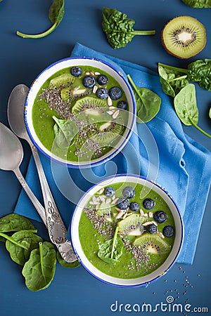 green smoothie bowl spinach kiwi blueberry lime banana with chia seed Stock Photo