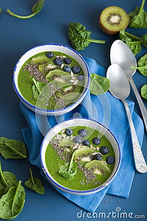 green smoothie bowl spinach kiwi blueberry lime banana with chia seed Stock Photo