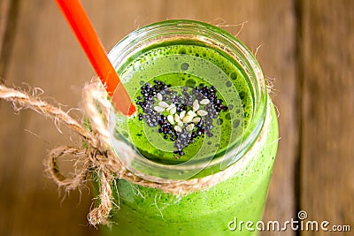 Green smoothie with heart of seeds Stock Photo