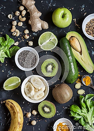 Green smoothie ingredients. Cooking healthy detox smoothies. On a dark background Stock Photo