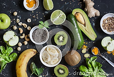 Green smoothie ingredients. Cooking healthy detox smoothies. On a dark background Stock Photo