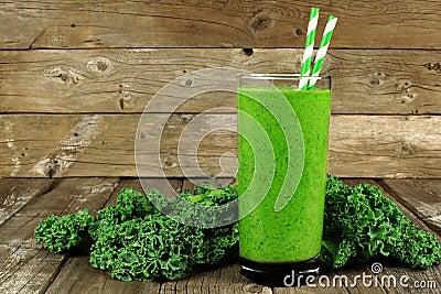 Green smoothie with kale on wood background Stock Photo