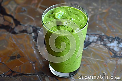 Green smoothie on a marble background Stock Photo