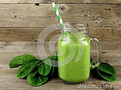 Green smoothie with spinach on wood Stock Photo