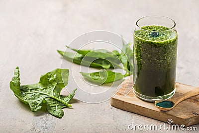 Green smoothie with spirulina. Young barley and chlorella spirulina. Detox superfood Stock Photo