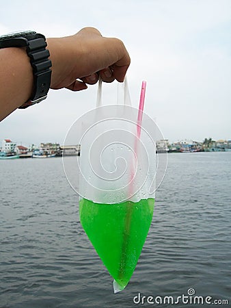 Green soda in plasticbag Stock Photo