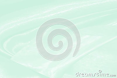 Elegrance soft fabric green background. Silky line curve shape fashion cloth abstract background with Beauty waves textured. luxur Stock Photo