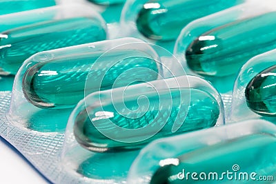 Green soft gel capsules pills in blister pack Stock Photo