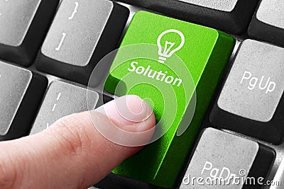 Green solution button on the keyboard Stock Photo