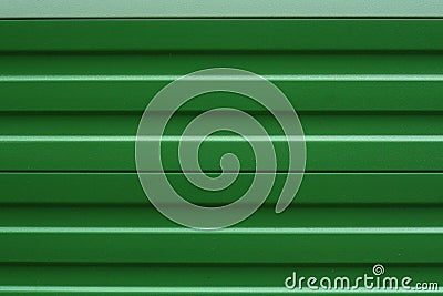 Green sound insulation wall besides a rail station near a residental area. Close-up. Fron view. Perfect background Stock Photo