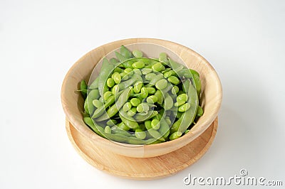 Green soybeans on a wooden bowl Stock Photo