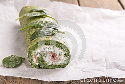 Green spinach roll with soft cheese and salmon Stock Photo